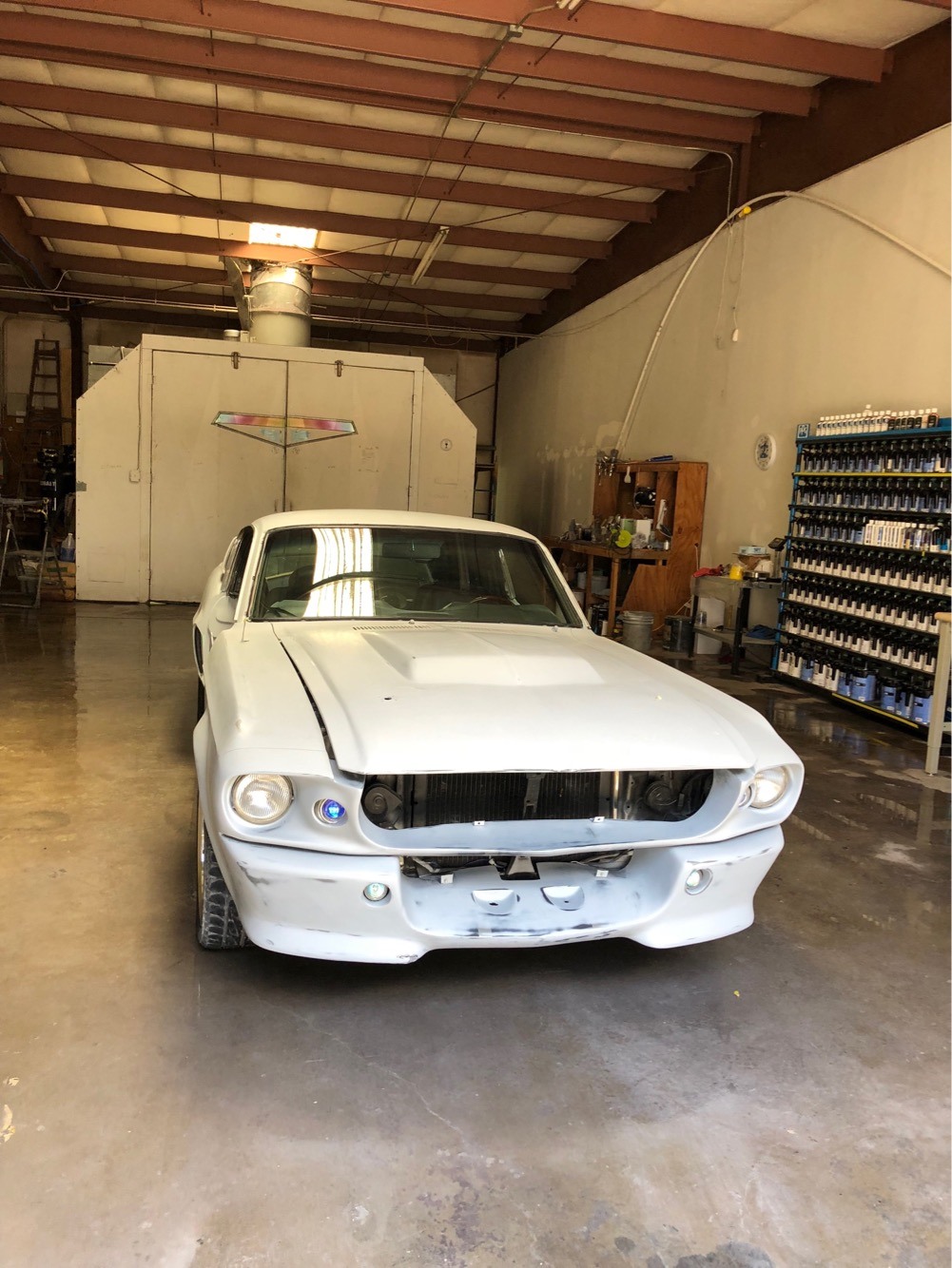 A classic Mustang restoration underway in the Mendez Body Shop paint bay
